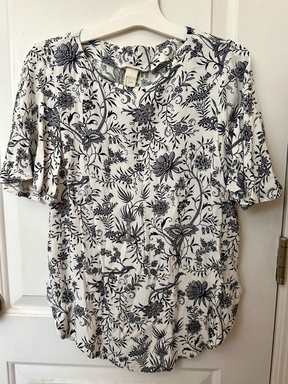 H&M White Short-Sleeve Blouse with Black Floral Outline Print